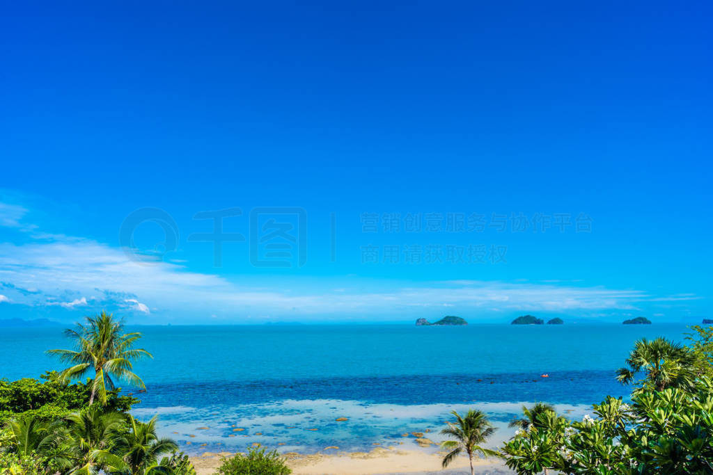 Beautiful tropical sea ocean with coconut palm tree on blue sky