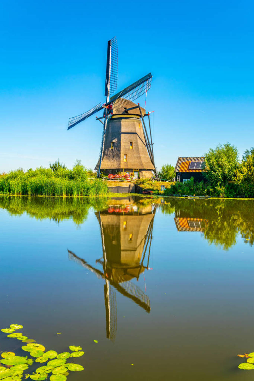 Kinderdijk windmills viewed during sunny summer day, Rotterdam,