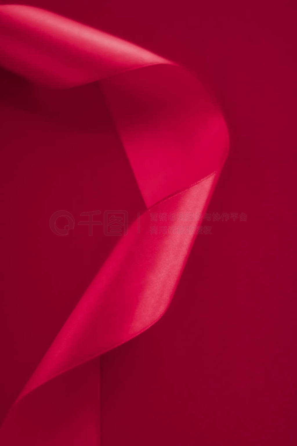 Abstract curly silk ribbon on pink background, exclusive luxury