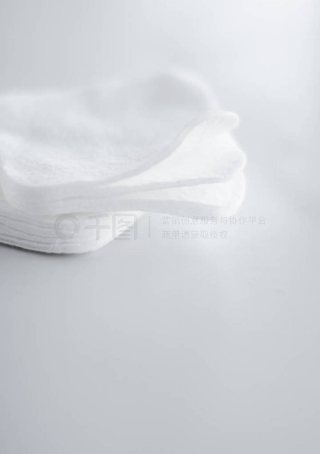 Organic cotton pads on marble background, cosmetics and make-up