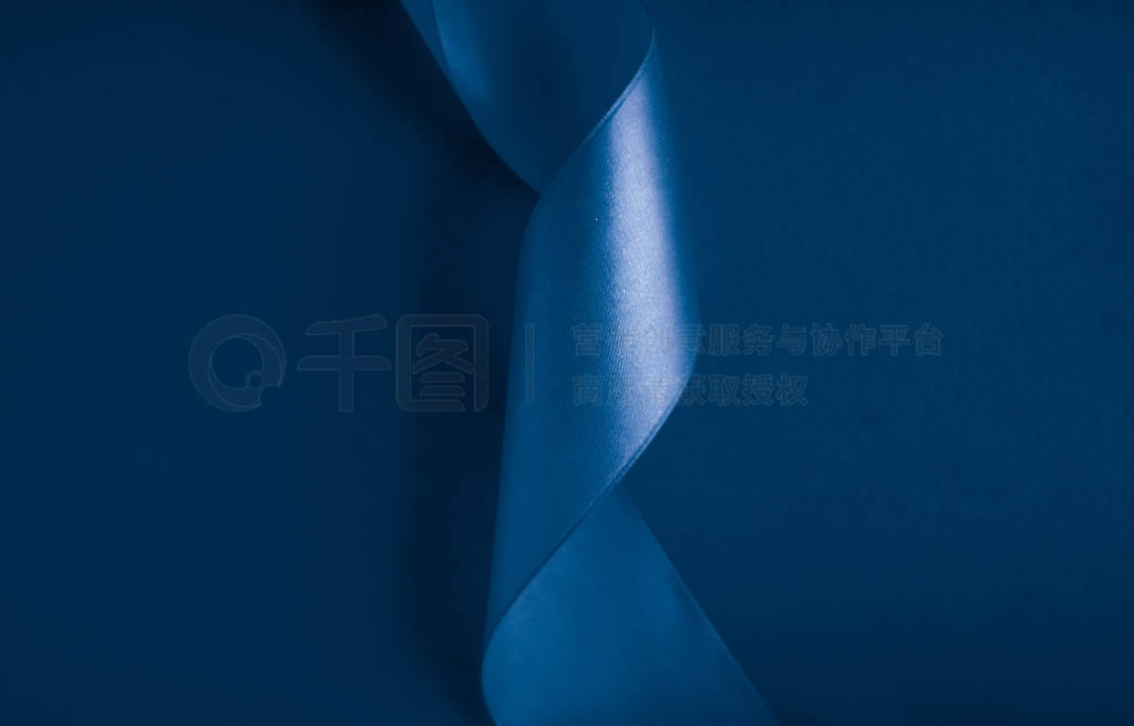 Abstract silk ribbon on royal blue background, exclusive luxury