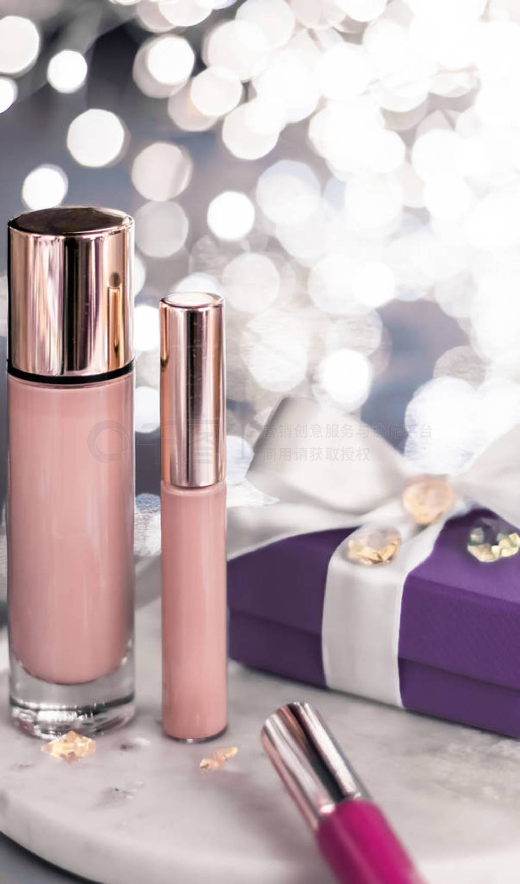 Holiday make-up foundation base, concealer and purple gift box,