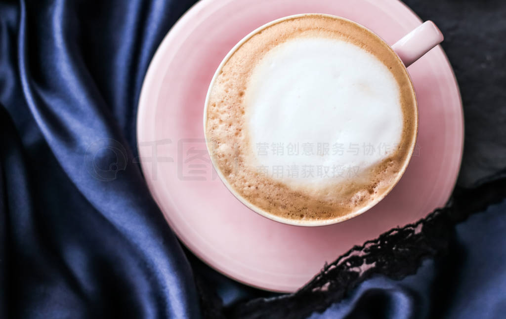 Cup of cappuccino for breakfast with satin and pearls jewellery