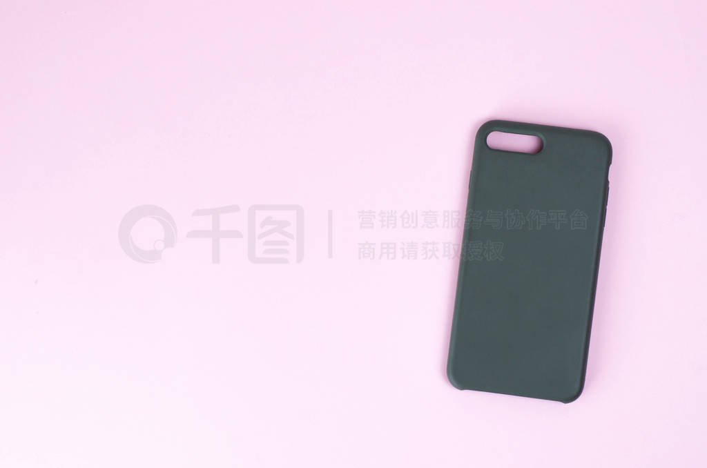 Silicone case for smartphone on a paper background.