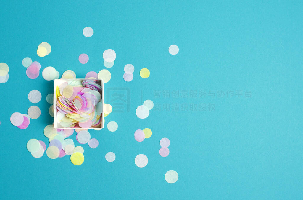 Turquoise festive background with confetti.