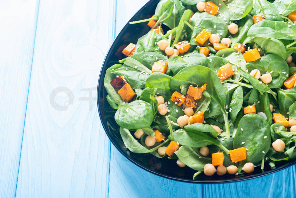 autumn salad with pumpkin , spinach , chickpea and sesame