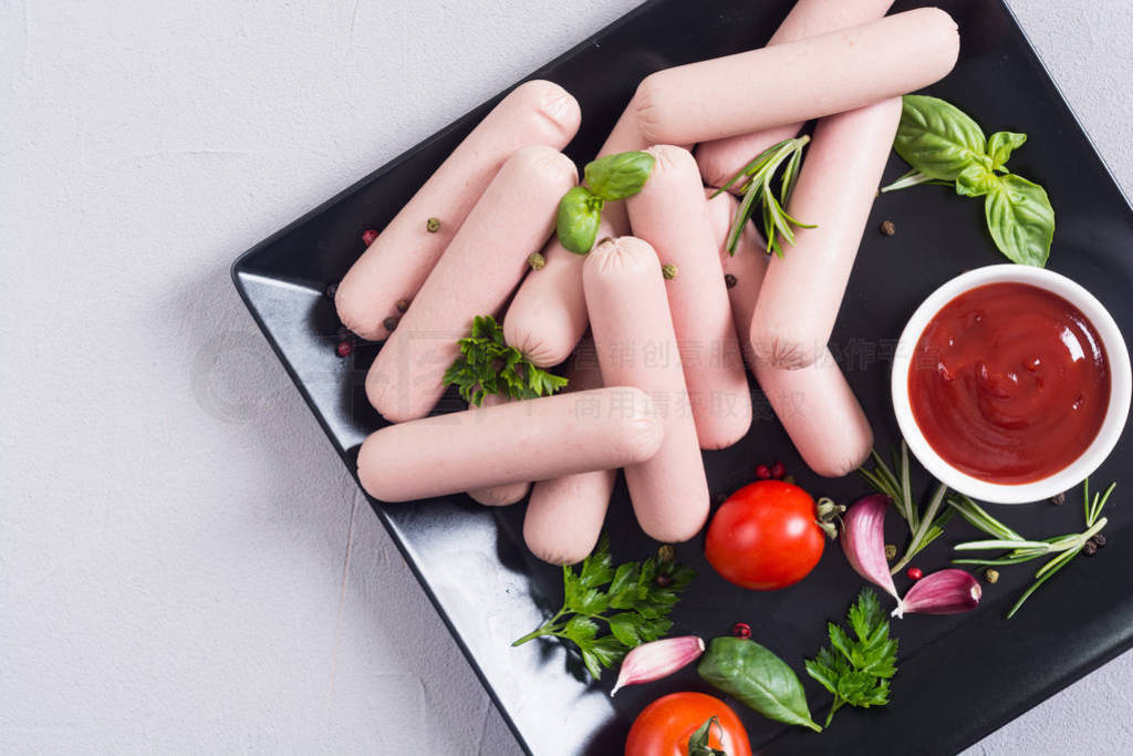 Raw beef sausages with pepper , herbs and ketchup