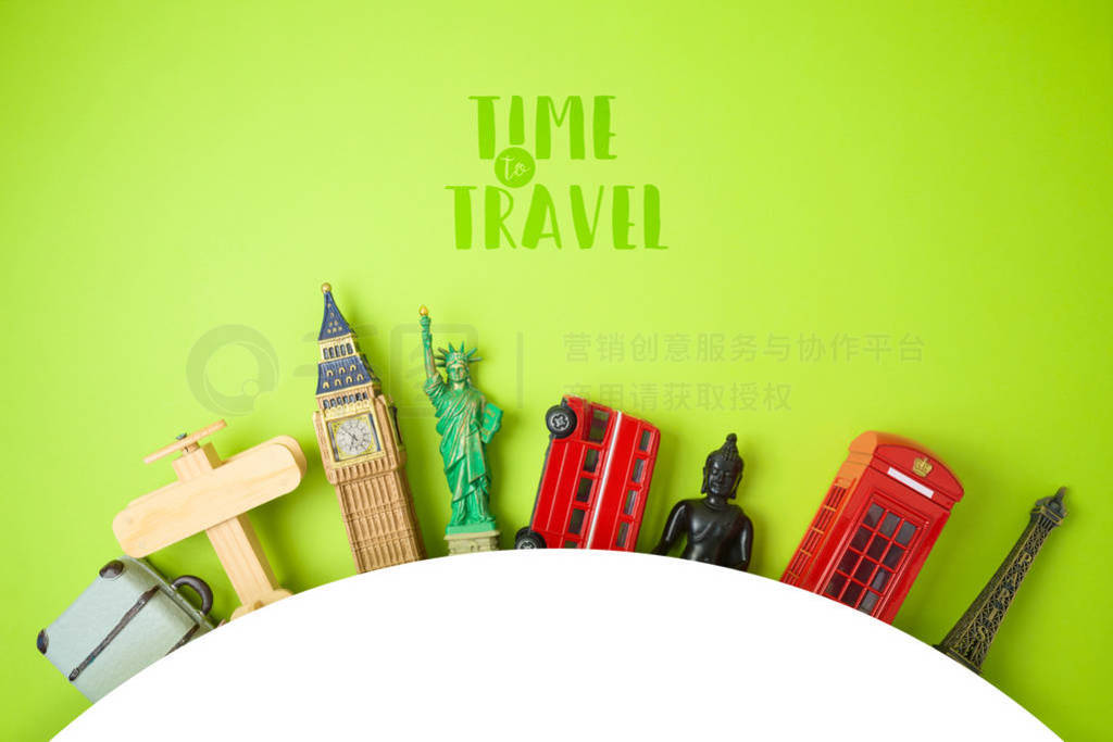 Travel and tourism concept with souvenirs on green background.