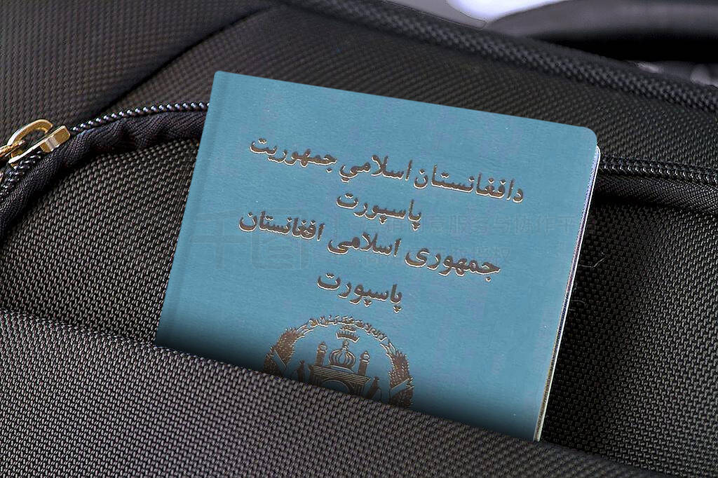 Close up of Afghanistan Passport in Black Suitcase Pocket