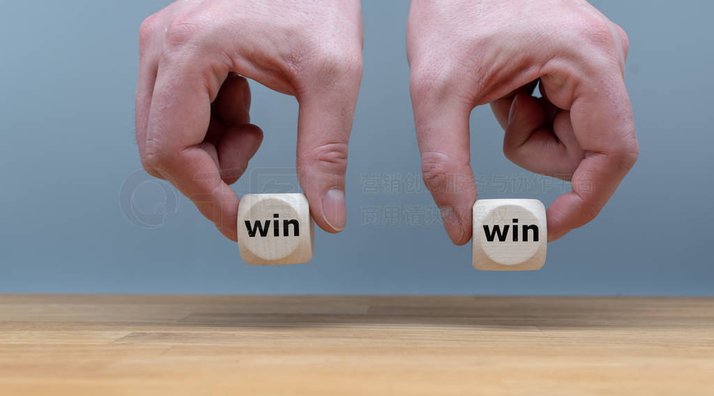 Symbol for a win win situation. Hands are holding two dice with