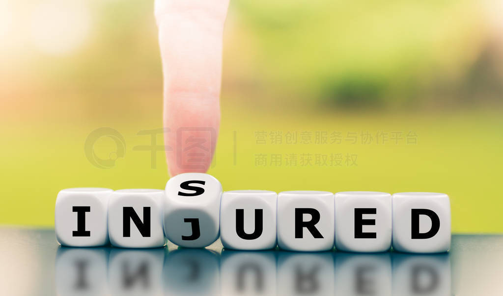 Be insured when injured. Hand turns a dice and changes the word