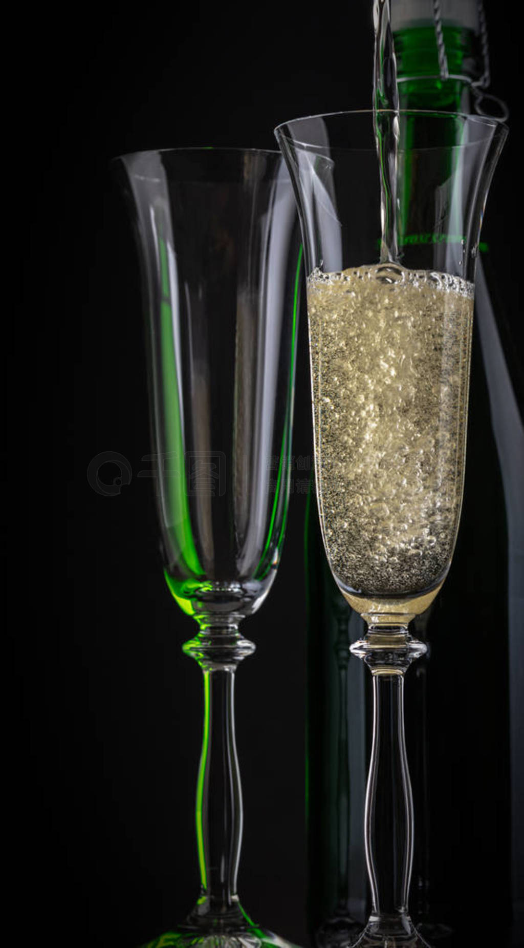 champagne is poured into a glass