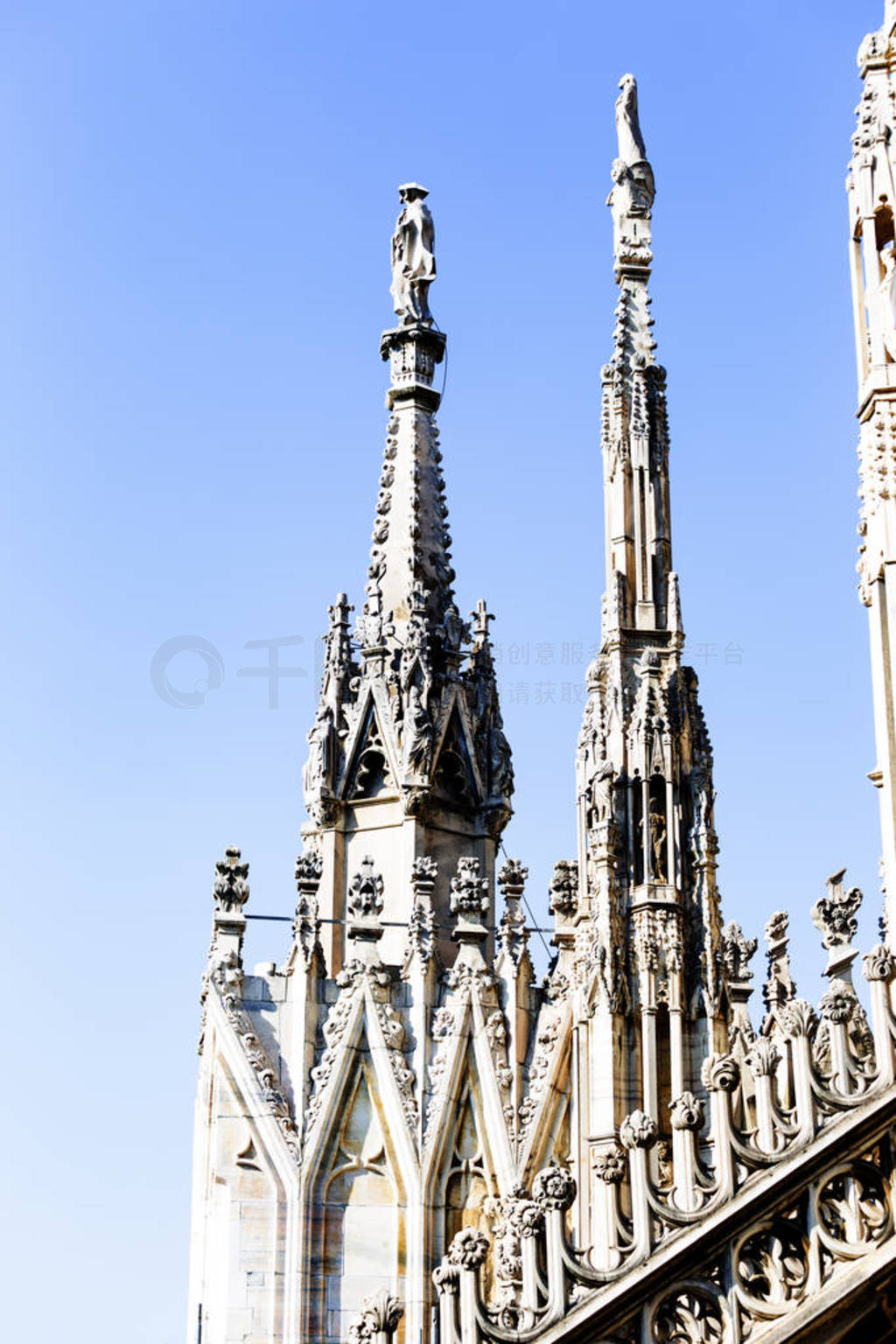 Aerial view of statue from Milan Duomo roof terrace , Italy