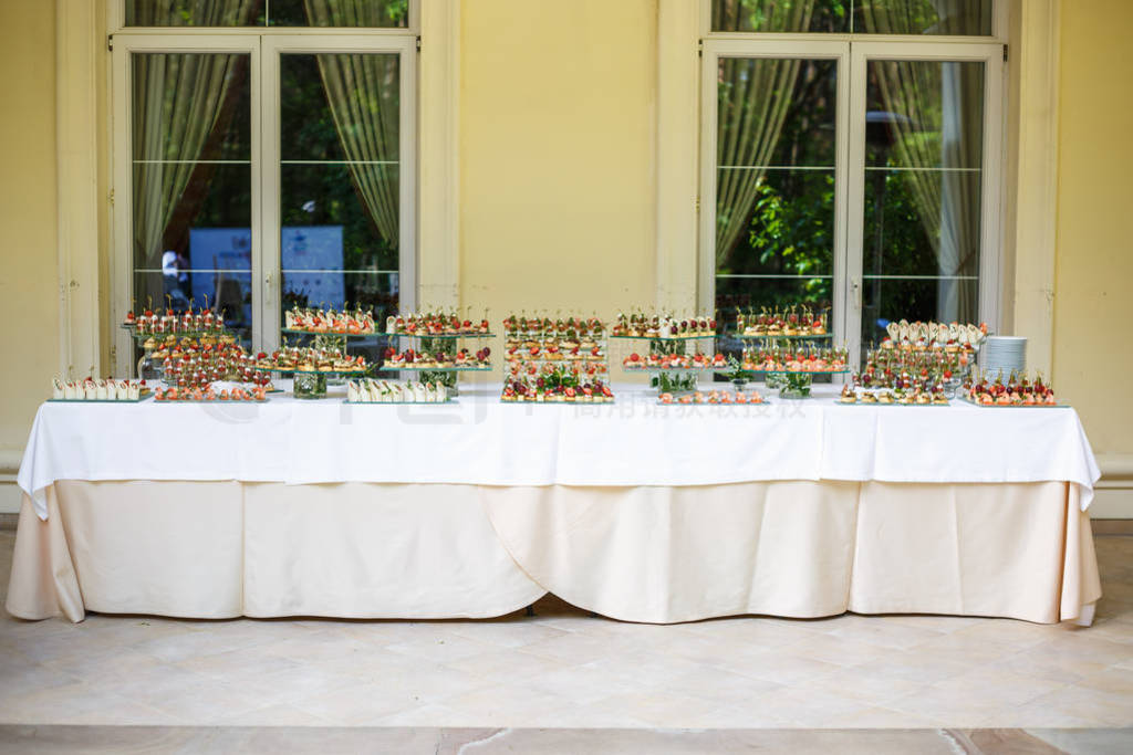 Catering. Off-site food. Buffet table with various canapes, sand