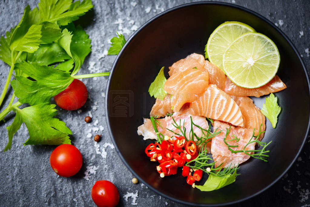 Salmon Salad / Fish salmon fillet on bolw and dark background -