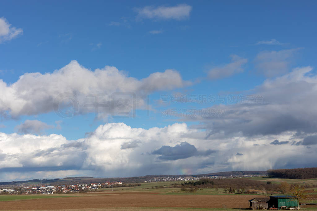 Green fields and blue skies over hessen in Germany