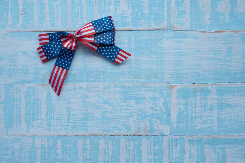 America ribbon on blue wood background.