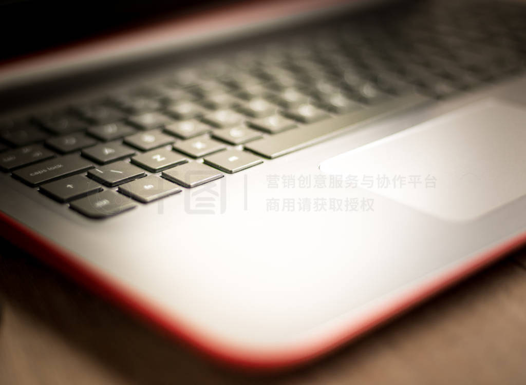Laptop keyboard with selective focus on the keys and a soft and