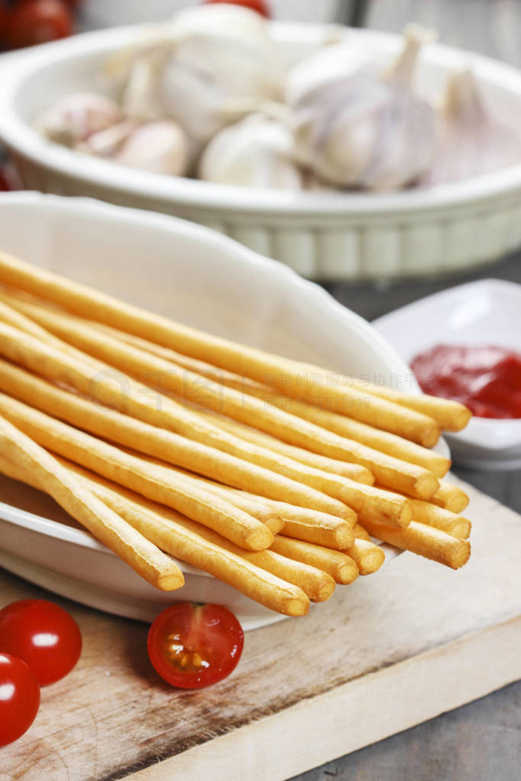 Traditional italian breadsticks on wooden table.