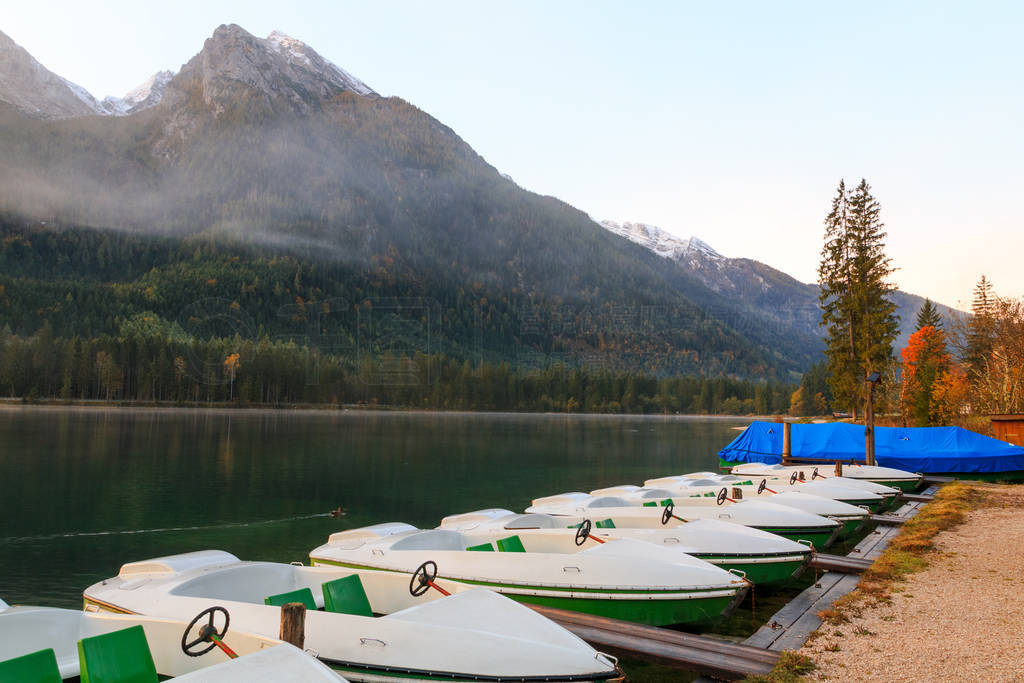 Beautiful autumn colors in the sunrise at the Hintersee lake in