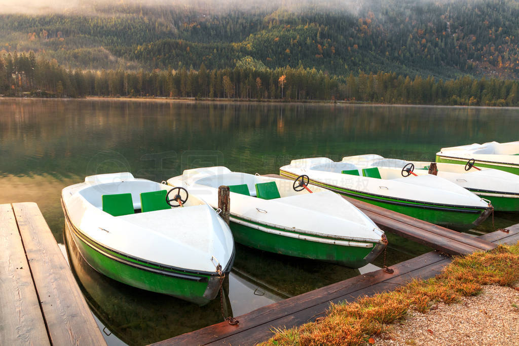 Beautiful autumn colors in the sunrise at the Hintersee lake in