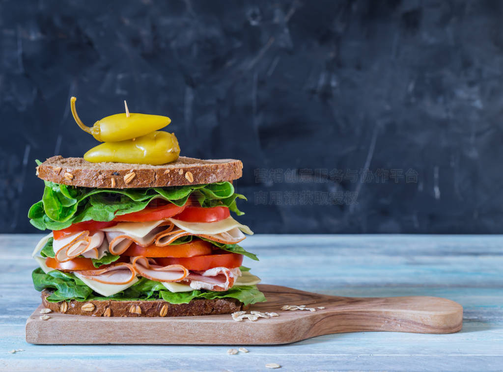 Ultimate Deli Sandwich on grey background