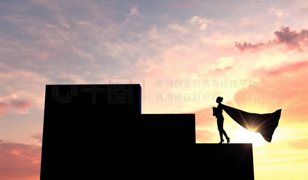 Silhouette of a superhero business woman wearing a cape against