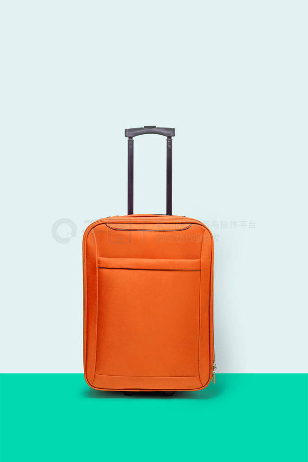 Orange suitcase standing in turquoise floor. Concept of tourism