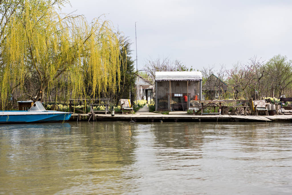 Houses on the river bank. Rest house, hotel on the river bank.