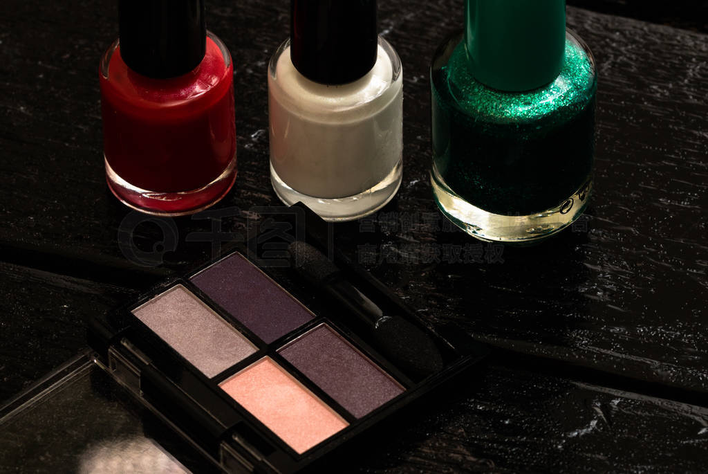 Various cosmetics on a black background. Beauty products, close