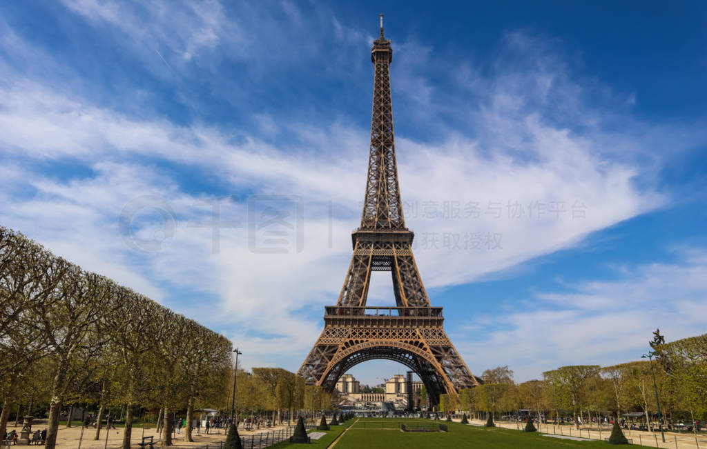 Eiffel Tower in Paris France against blue sky with clouds. View