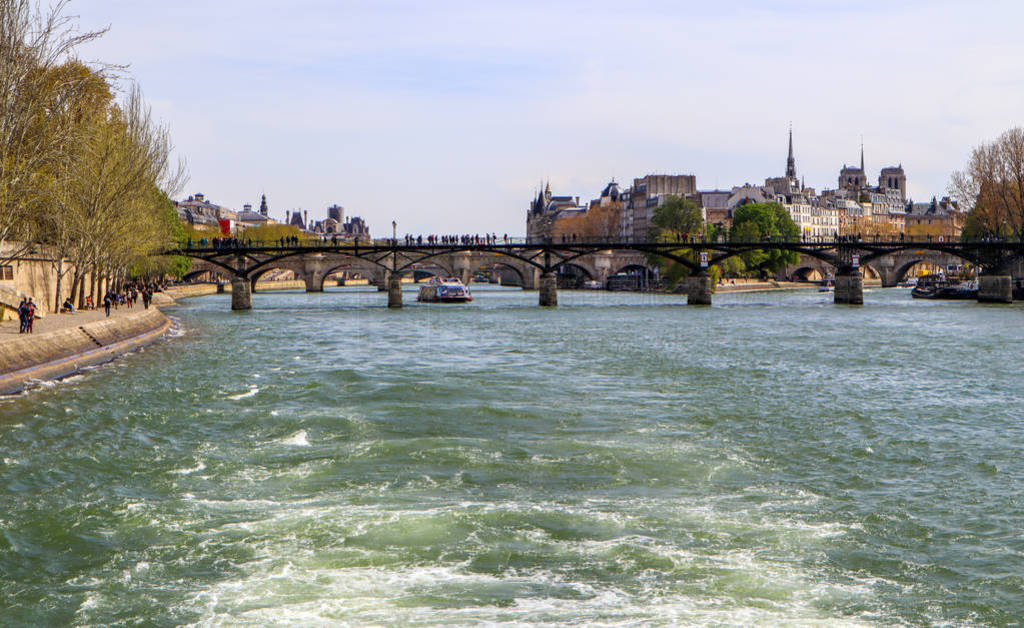 Pedestrian bridge (Pont des Arts) over Seine river and historic