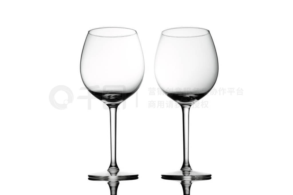 Empty elegant Crystal wine glasses with wine isolated on white b