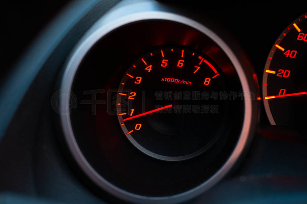 Close up of car speedometer with the needle pointing at 1 krpm