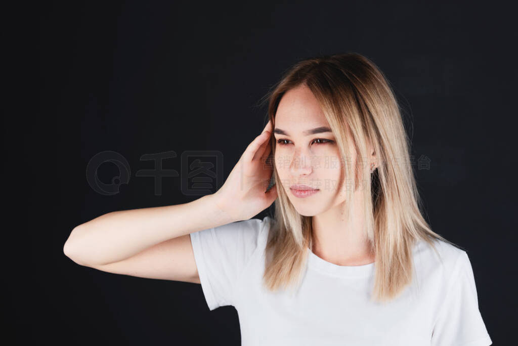 Emotional portrait of a girl holding her head in her hands, feel