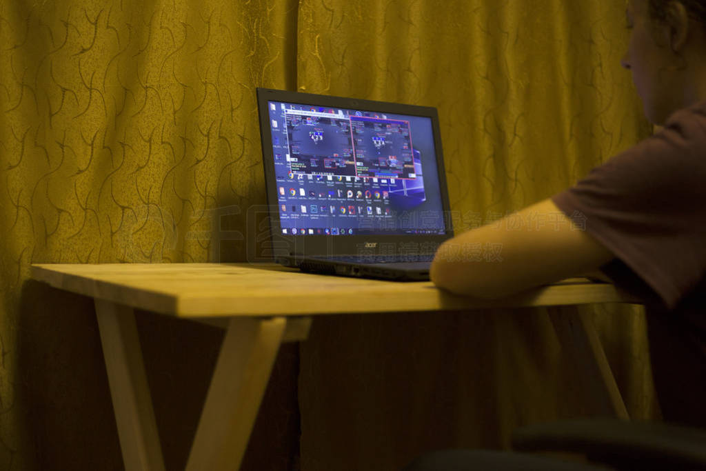 Kiev, Ukraine 05.12.2019 : girl playing online poker for laptop
