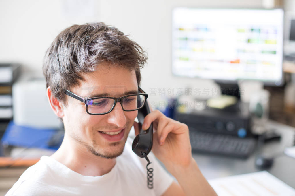 Employee is talking on the phone with customers