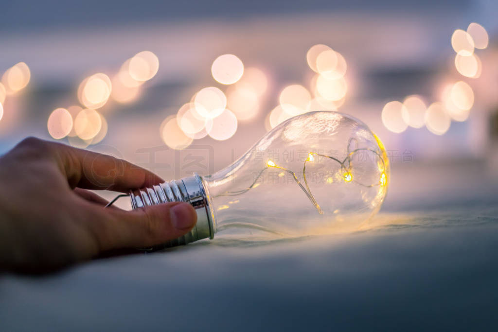 Ideas and innovation: Light bulb with LEDs is lying in the bed,