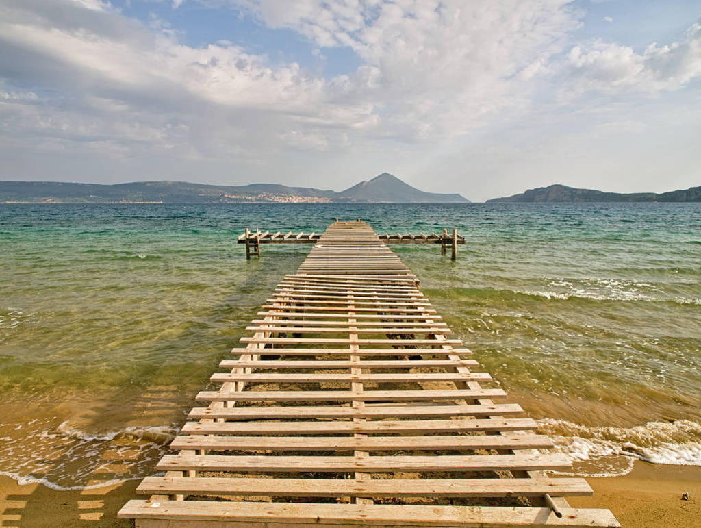 Rough wooden pier, over sea water, Gialova lagoon, Peloponnese,