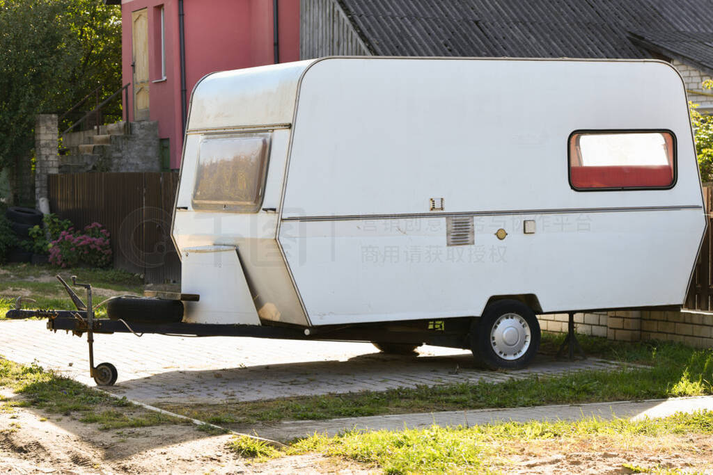 white trailer van. A motor home in the form of a white trailer i