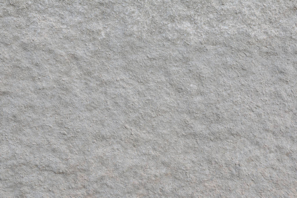 The wall covered with gray rough plaster. Background.