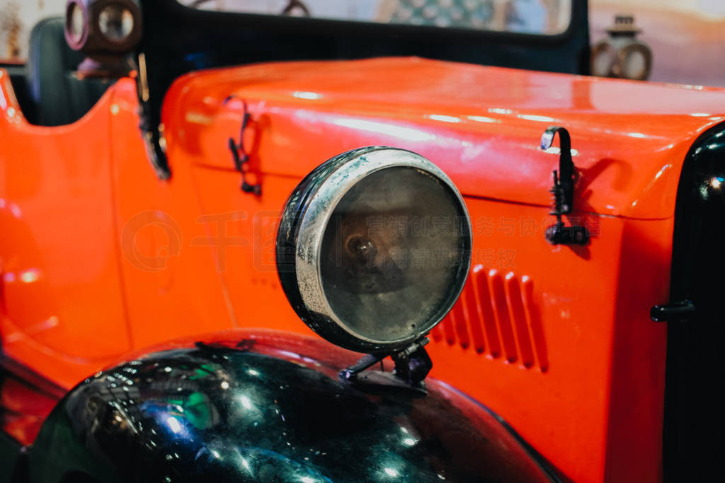 headlight of red vintage old classic car