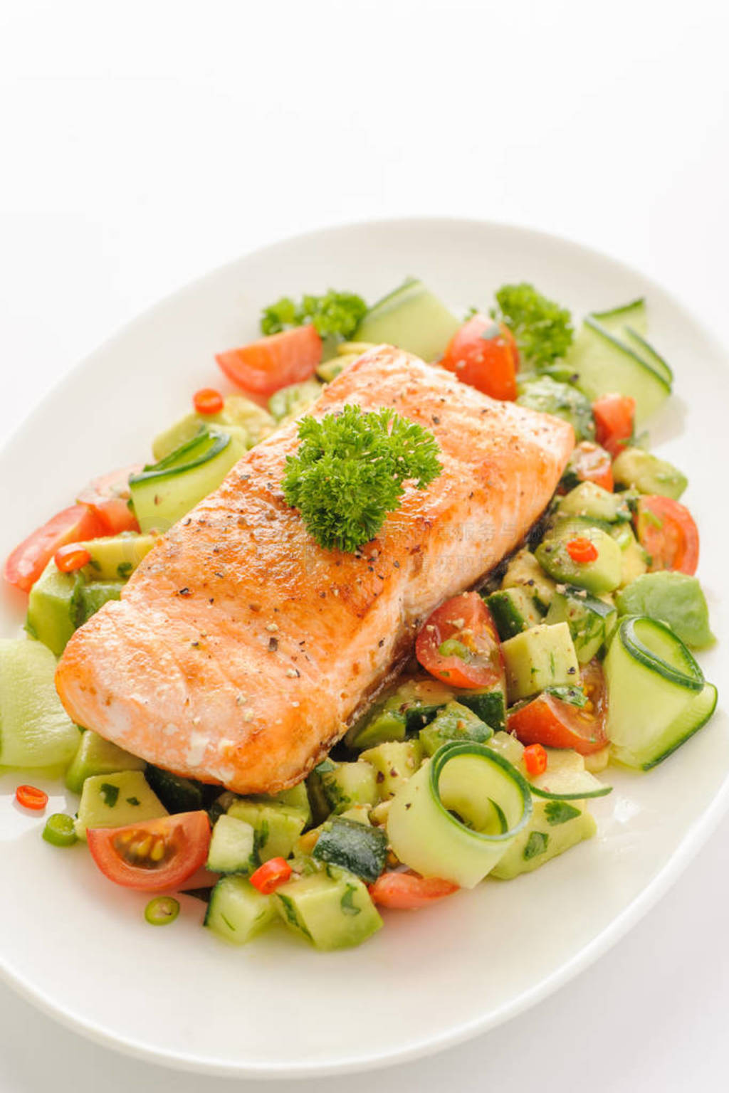 Grilled salmon fillet with vegetable salad.