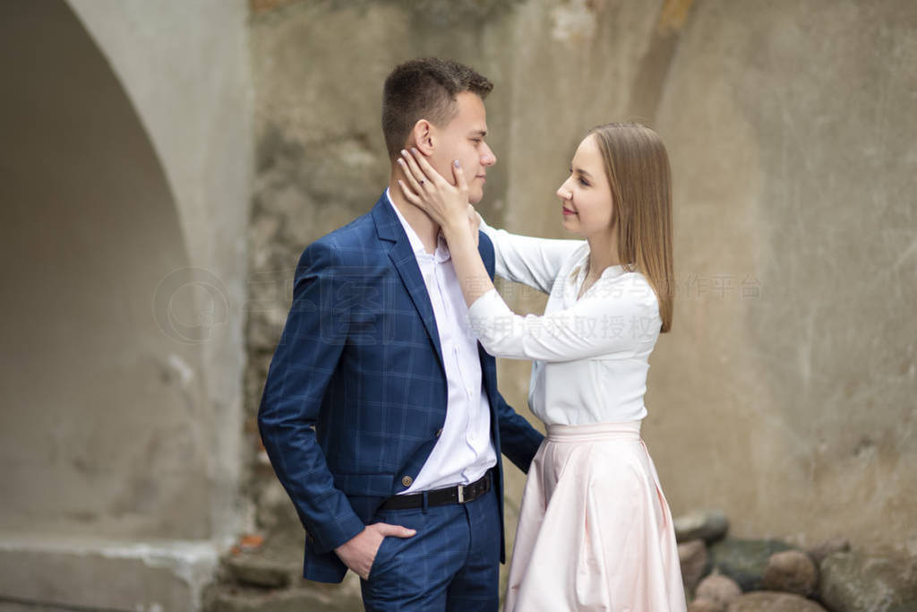 Happy Caucasian Couple Posing Embraced Together Outdoors.