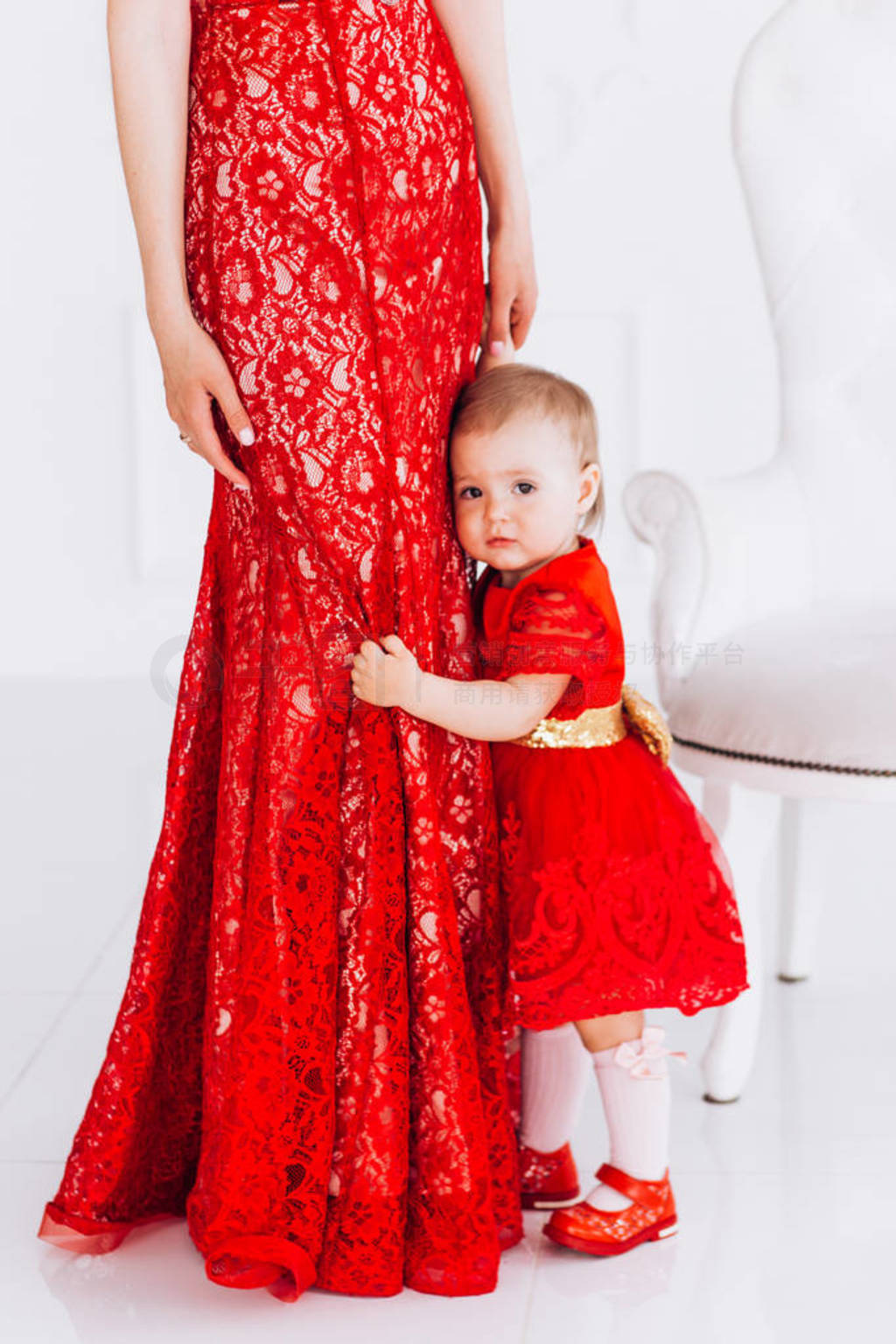 Nice, family, good photo of mother and daughter in red dresses i