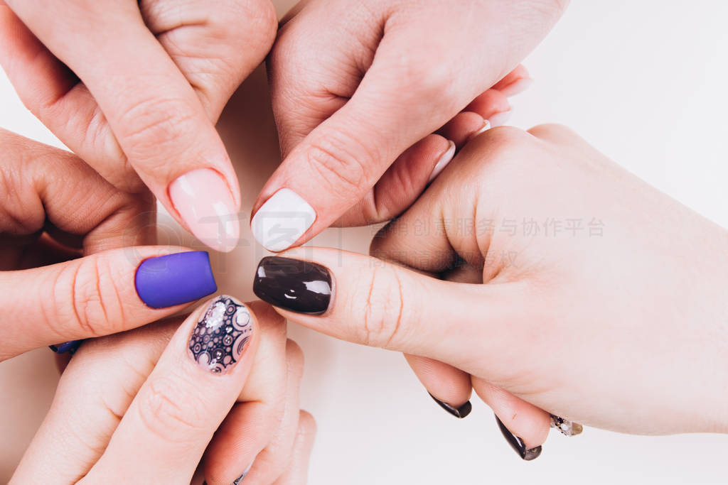 Delicate girlish hands with a stylish manicure in the form of a