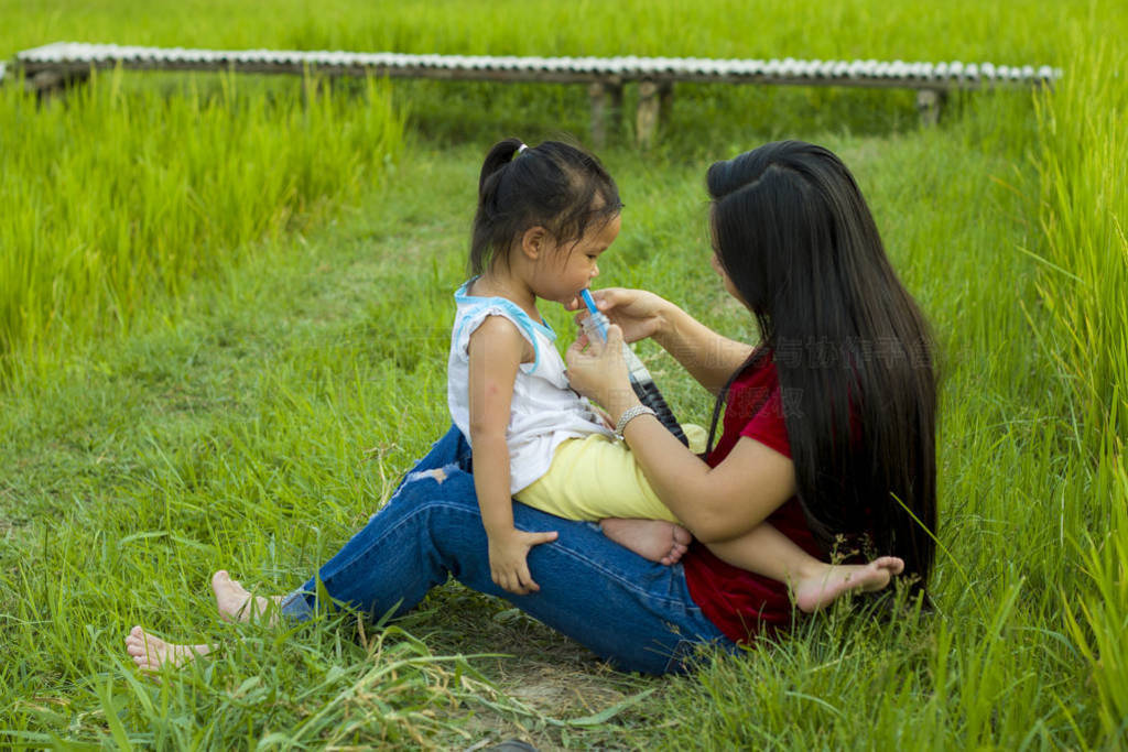 Lifestyle portrait mom and daughter in happiness at the outside