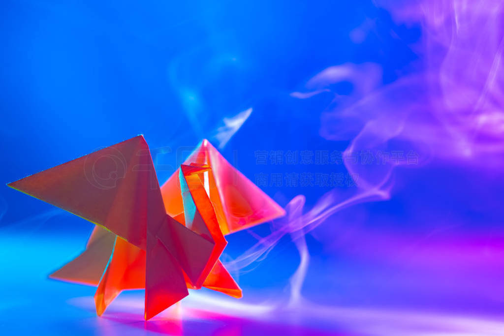 Emoji. Origami paper. Red dragon on blue Smoking background. The