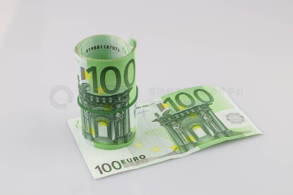 Roll of one hundred euro banknotes with a rubber band, isolated