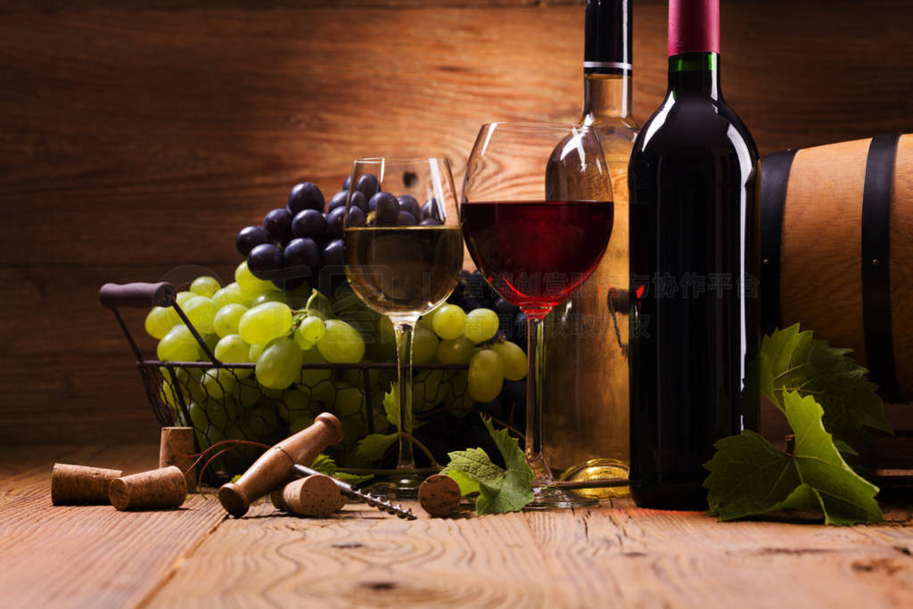 Glasses of red and white wine, served with grapes